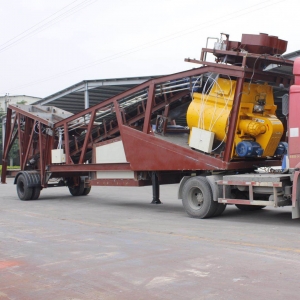 Truck trailing concrete plant